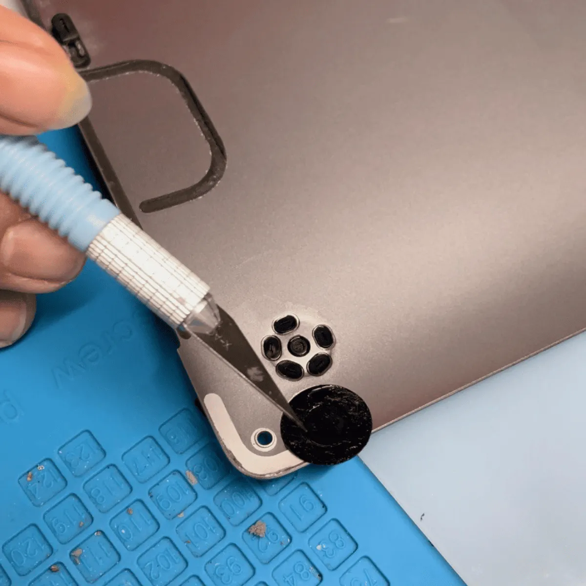 MacBook Pro bottom case lifted for access