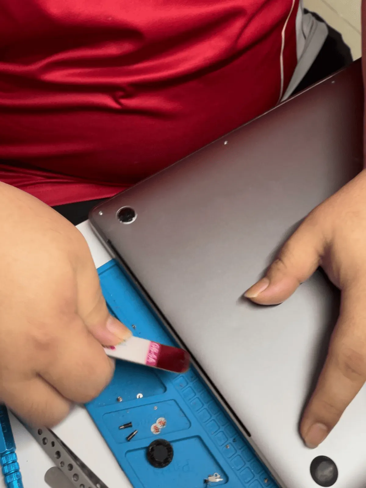 MacBook being checked at the counter before any repair